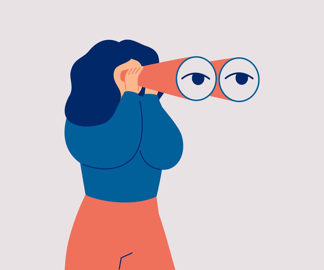 woman looks through her large binoculars, looking for something