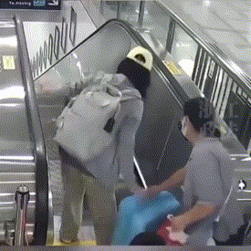 Popular GIF of a woman falling on an escalator. 
