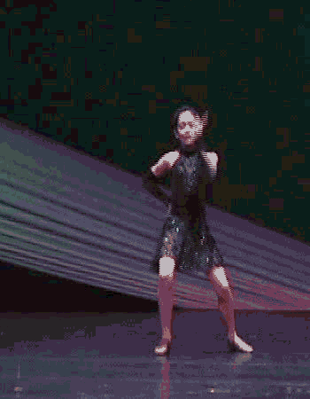 A GIF of a dancer doing a front flip