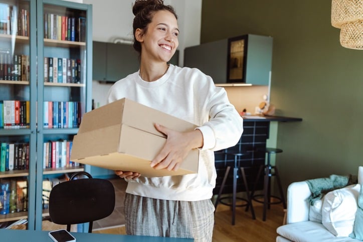 Young woman with a subscription box