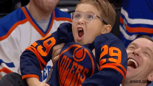 Excited kid at sports game gif