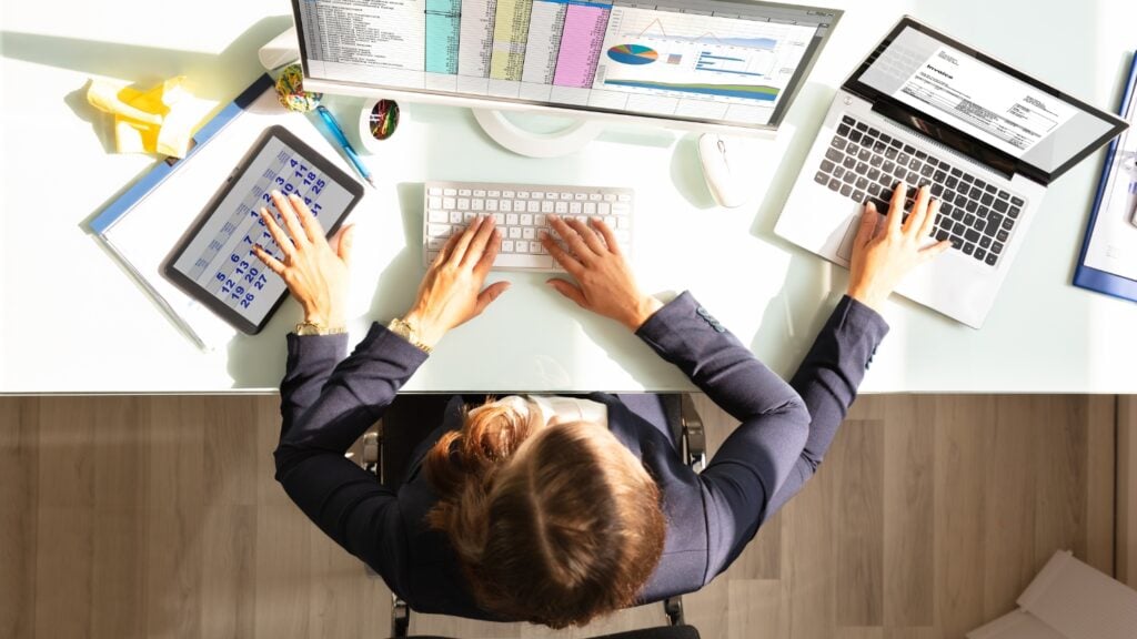 Worker multitasking at their desk