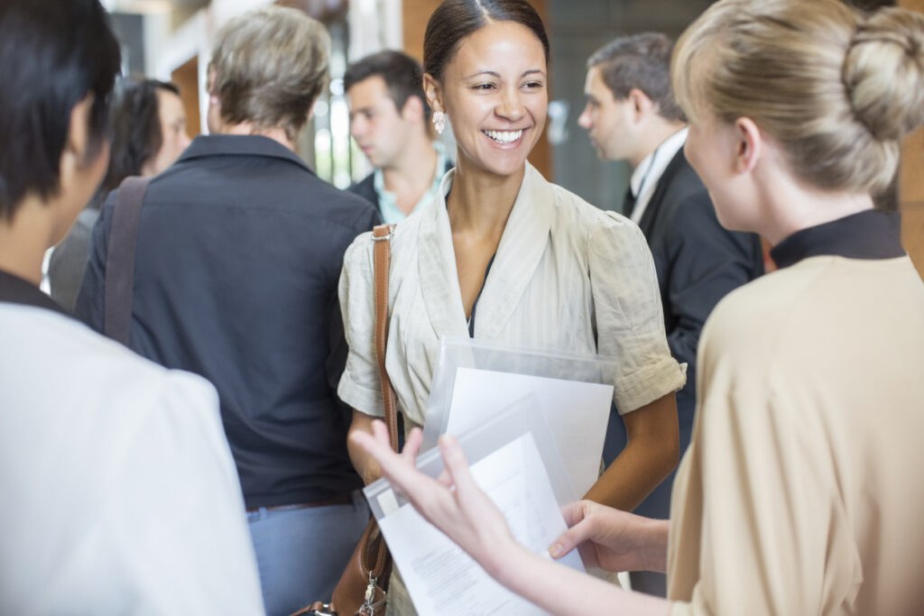 3 People Networking in a crowded lobby