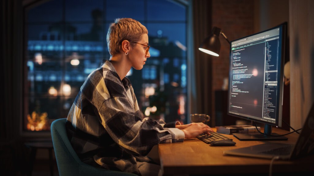 Young developer working at night