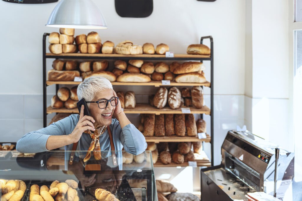 Owner of a bakery business on the phone 