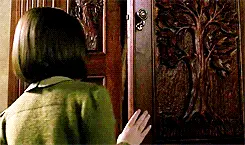Lucy opening the wardrobe in Chronicles of Narnia