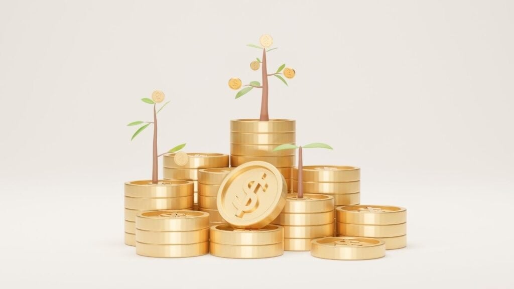 Coin stacks with trees growing from them.