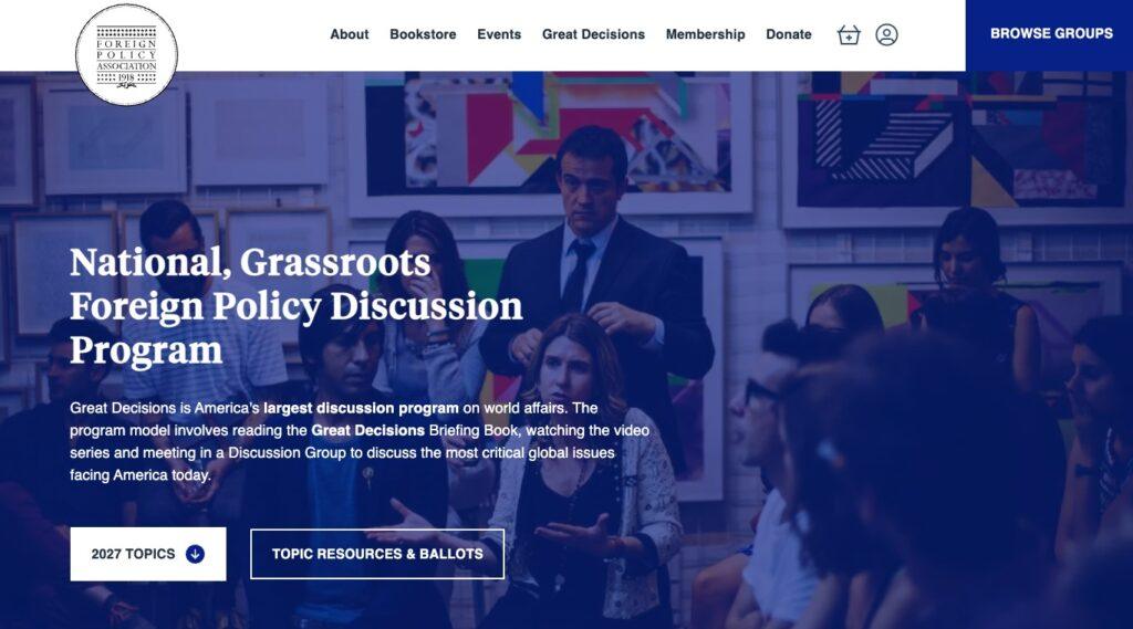 Hero section with a diverse group in a discussion, blue overlay, and a large white title:'National, Grassroots Foreign Policy Discussion Program'; circular Foreign Policy Association logo in the top-left and a white navigation bar above.