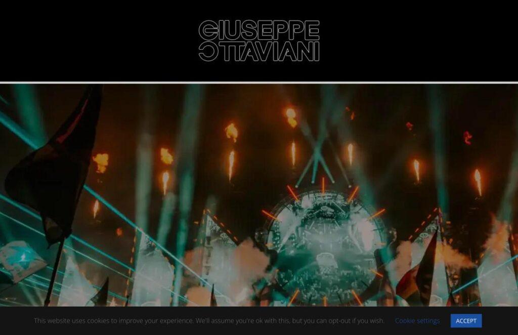Giuseppe-Ottaviani | MemberPress Promo banner for Giuseppe Ottaviani featuring a concert stage with lasers and torches.