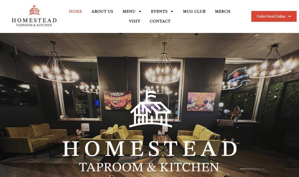 Homestead Taproom and Kitchen Homepage Screenshot | MemberPress Interior of Homestead Taproom & Kitchen: cozy lounge seating, warm pendant chandeliers, wall art, with a white Homestead logo overlay.