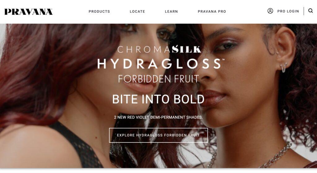 PRAVANA Homepage Screenshot | MemberPress Close-up of two women with bold makeup on a beauty banner advertising ChromaSilk HydraGloss Forbidden Fruit.
