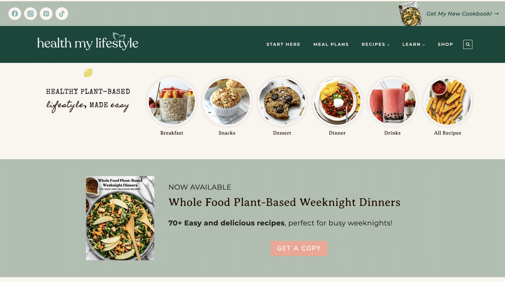 Health My Lifestyle homepage 2026 | MemberPress Six circular food-category icons (Breakfast, Snacks, Dessert, Dinner, Drinks, All Recipes) on a plant-based lifestyle site navigation row, with food photos as labels and headings above.