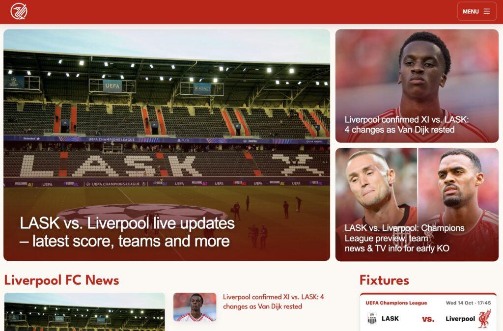 This is Anfield Homepage Screenshot | MemberPress Hero image of an empty stadium with UEFA banners and the headline 'LASK vs Liverpool live updates' overlaid, on a sports news site