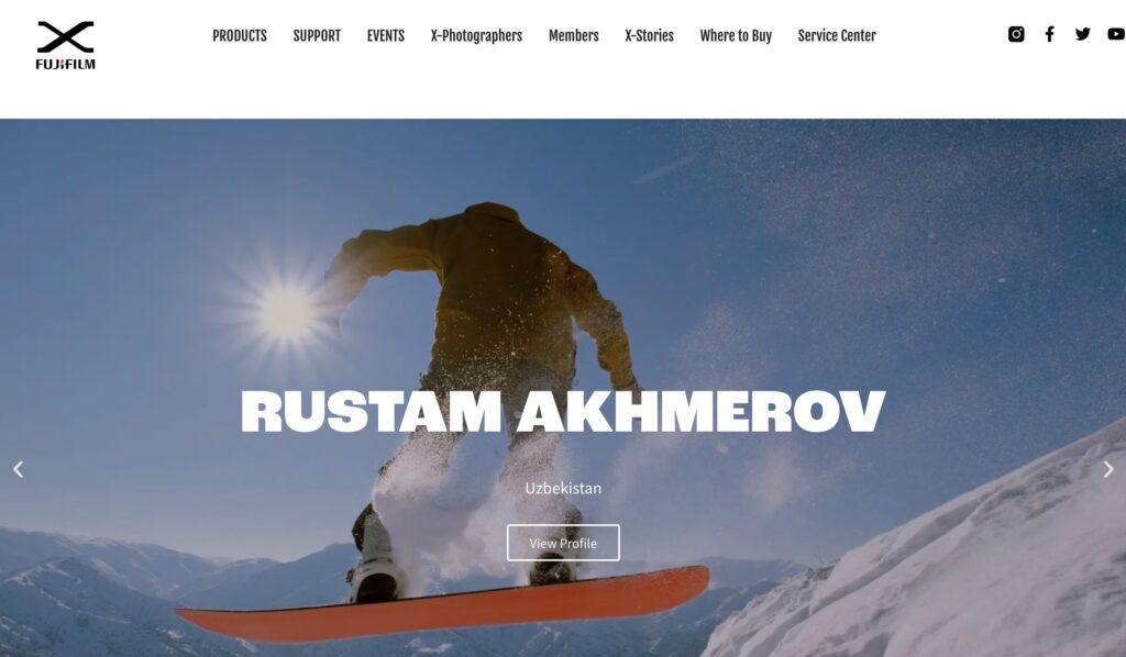 fujifilm xmea Homepage Screenshot | MemberPress Snowboarder mid-air jump on a sunny snowy mountain; Rustam Akhmerov profile page showing Uzbekistan